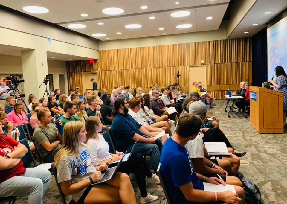A full room of students listen in on a panel discussion about PFAS in Michigan.